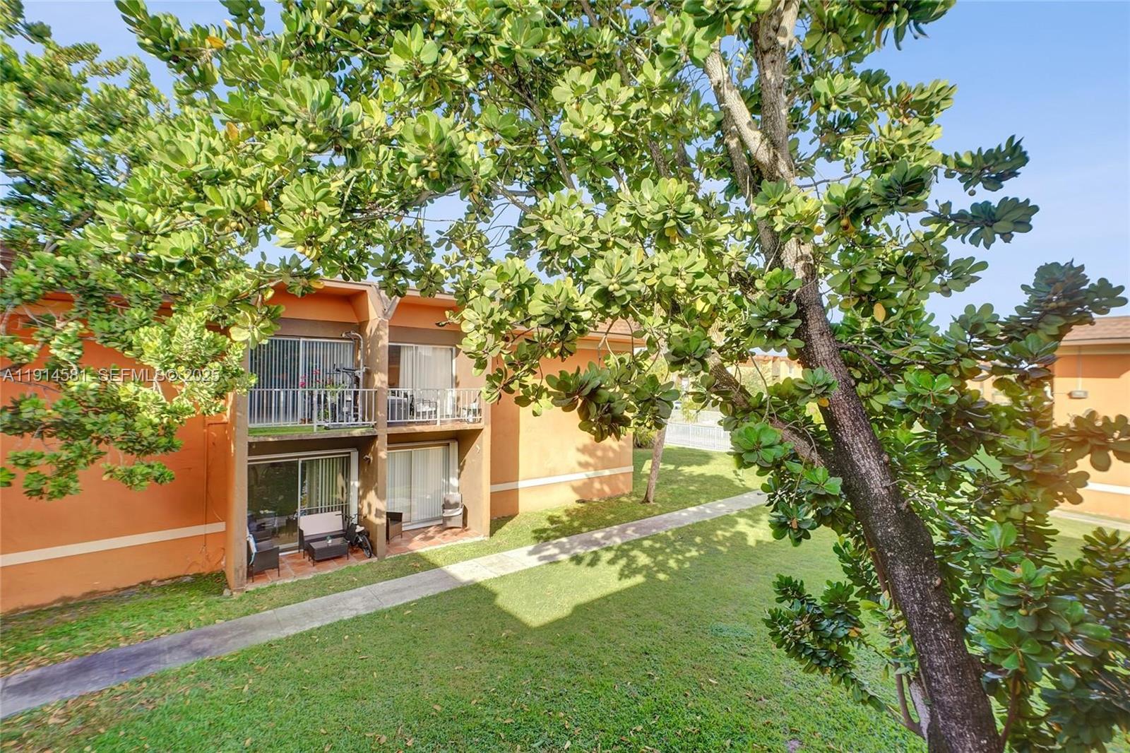 9459 Southwest 76th Street, Unit R7 Miami, FL 33173 - Photo 11 of 21 a view of house with yard