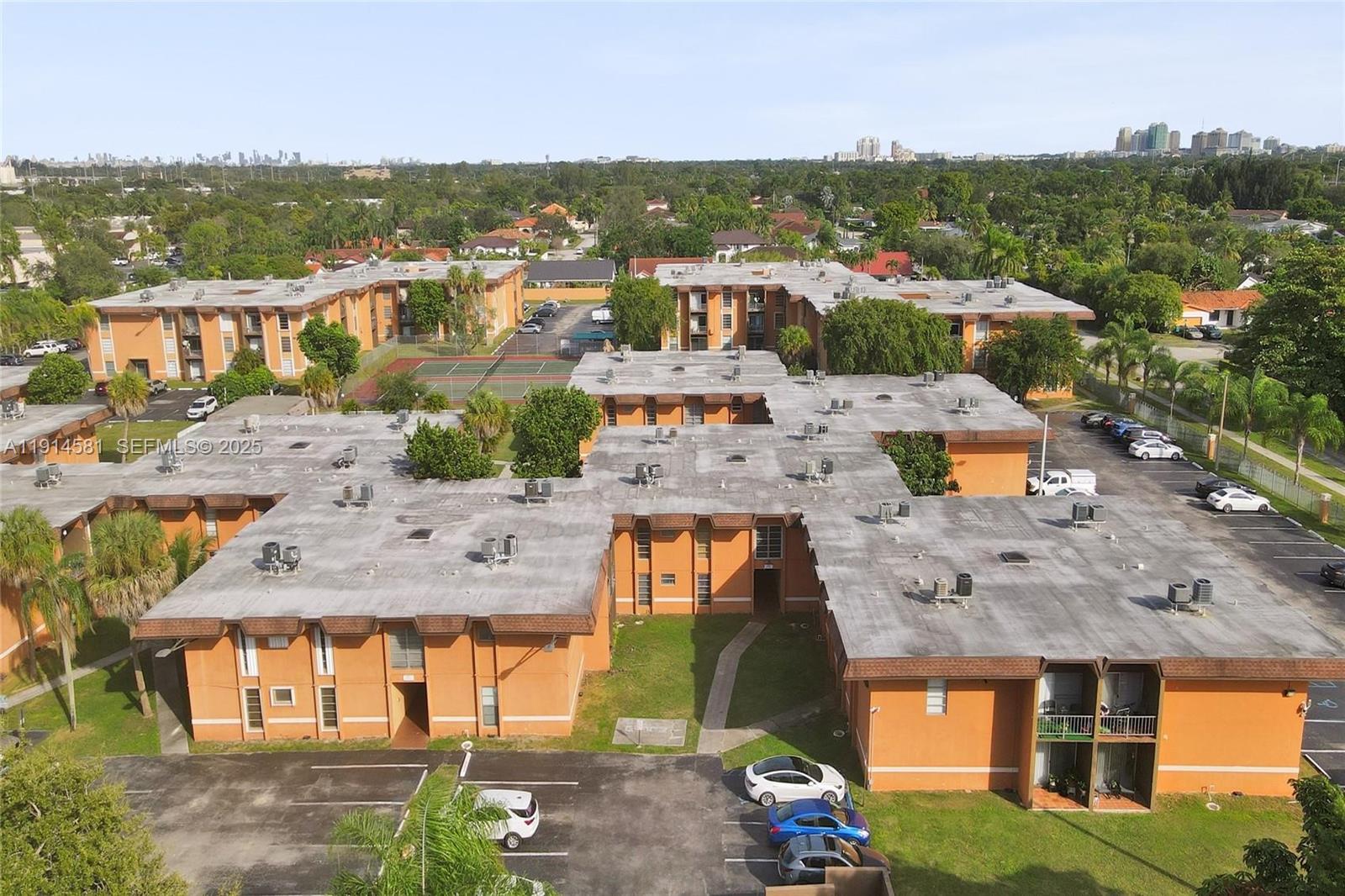 9459 Southwest 76th Street, Unit R7 Miami, FL 33173 - Photo 13 of 21 an aerial view of residential houses with outdoor space