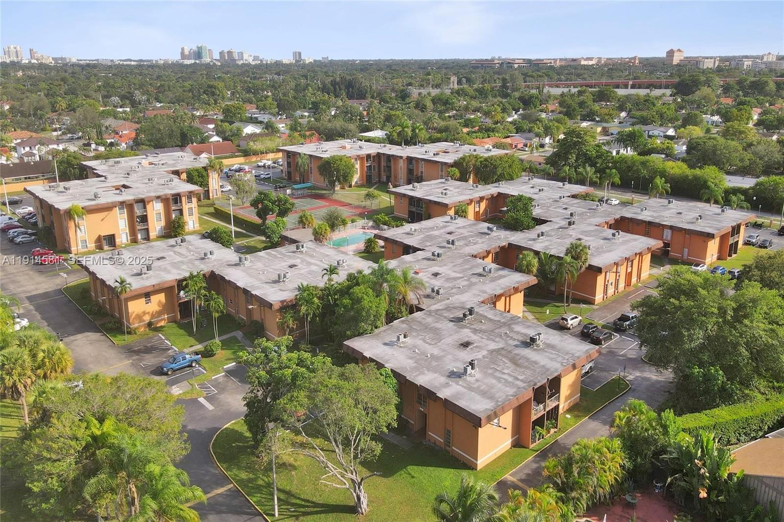 9459 Southwest 76th Street, Unit R7 Miami, FL 33173 - Photo 15 of 21 an aerial view of residential houses with outdoor space