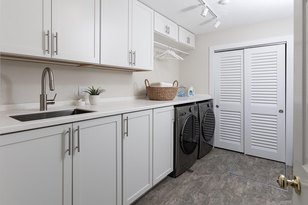 51 Rawson Road, Unit 51 Brookline, MA 02445 - Photo 11 of 23 a utility room with cabinets