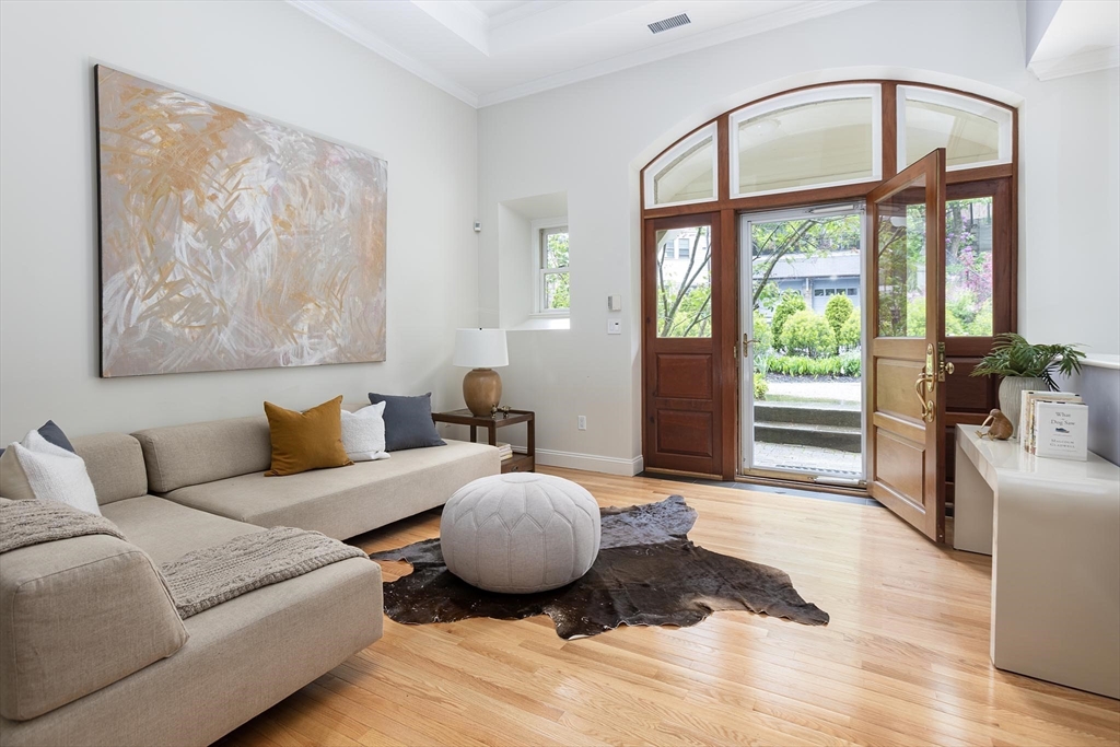 51 Rawson Road, Unit 51 Brookline, MA 02445 - Photo 13 of 23 a bedroom with furniture and wooden floor