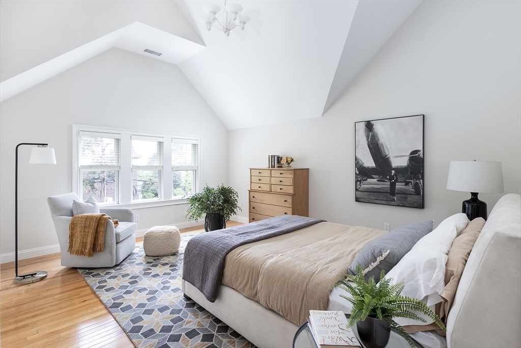 51 Rawson Road, Unit 51 Brookline, MA 02445 - Photo 16 of 23 a bedroom with a large bed and a couch