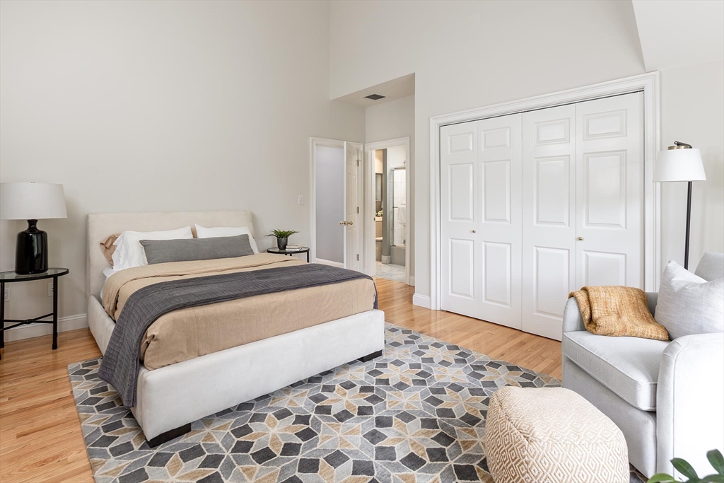 51 Rawson Road, Unit 51 Brookline, MA 02445 - Photo 17 of 23 a bedroom with a bed and a couch