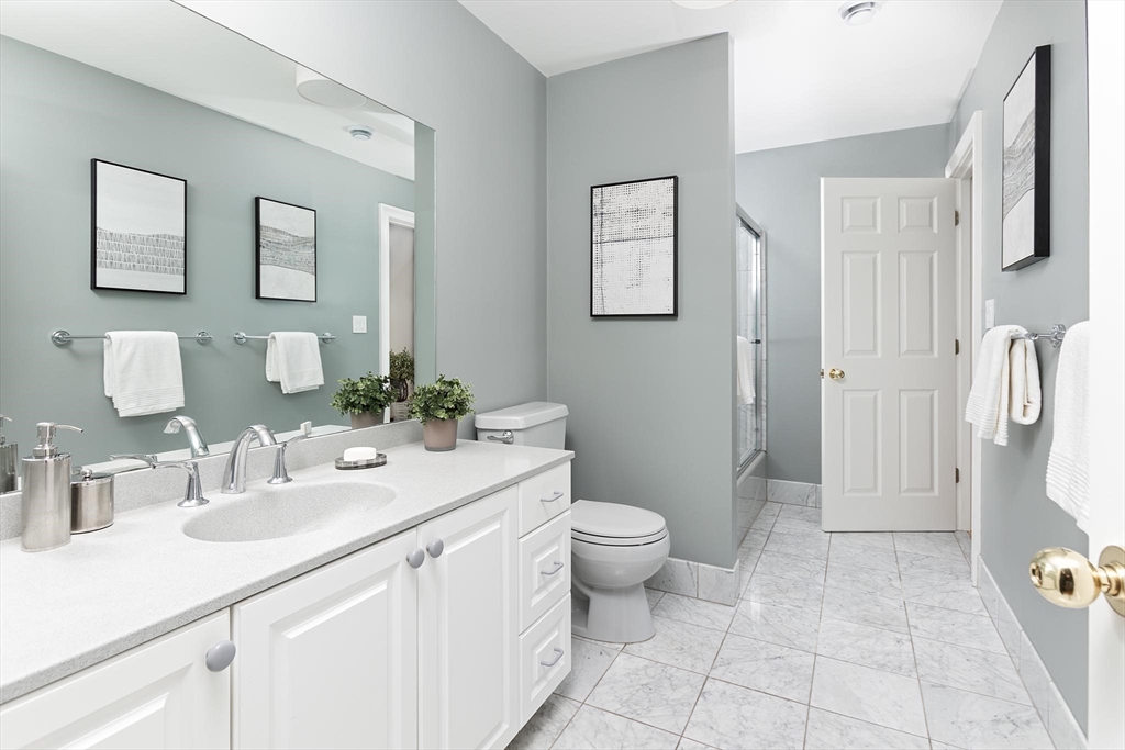 51 Rawson Road, Unit 51 Brookline, MA 02445 - Photo 18 of 23 a bathroom with a sink toilet and shower
