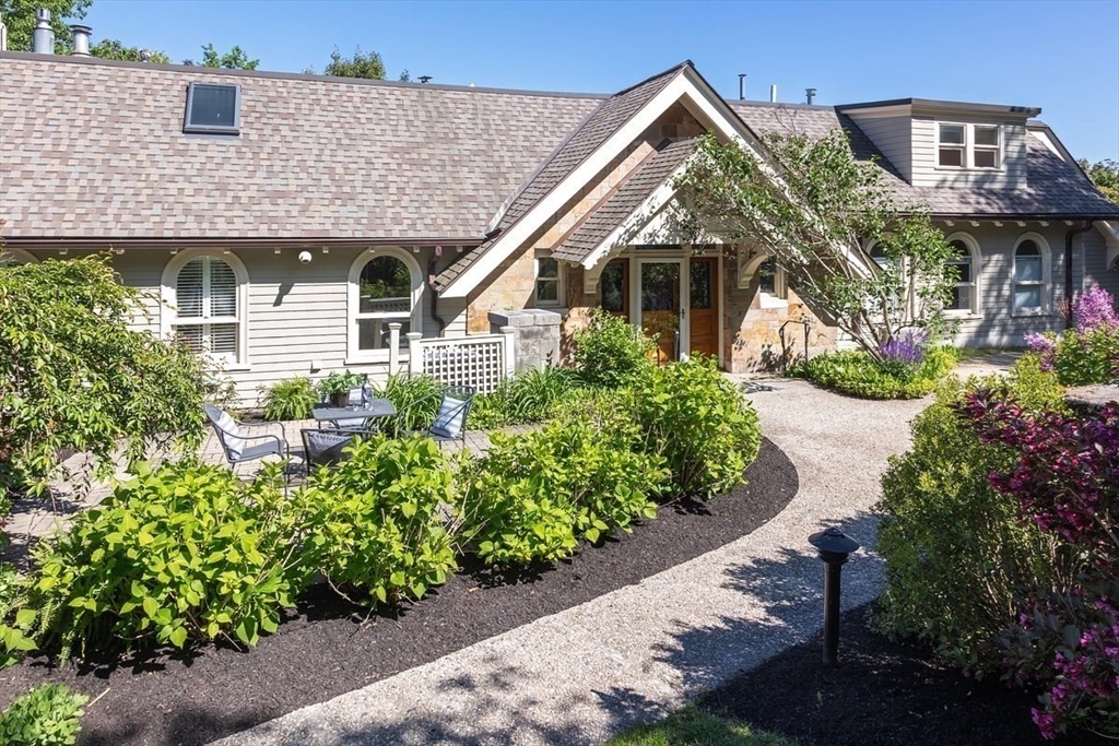 51 Rawson Road, Unit 51 Brookline, MA 02445 - Photo 23 of 23 a front view of a house with a yard