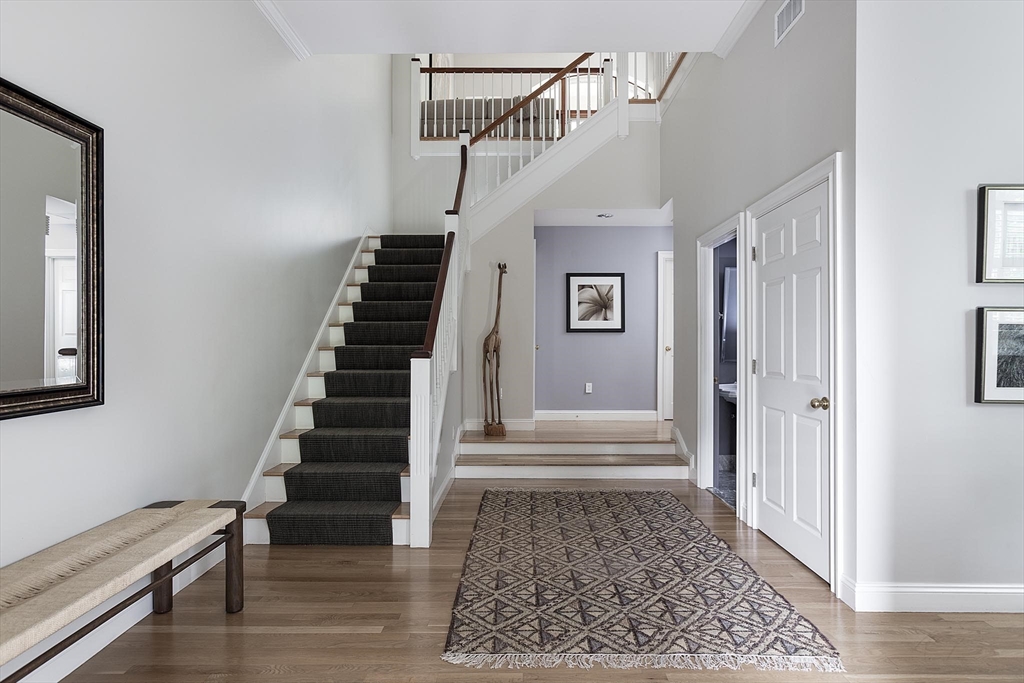51 Rawson Road, Unit 51 Brookline, MA 02445 - Photo 3 of 23 a view of entryway and hall with wooden floor
