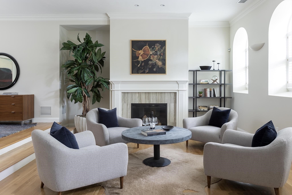 51 Rawson Road, Unit 51 Brookline, MA 02445 - Photo 6 of 23 a living room with furniture and a fireplace