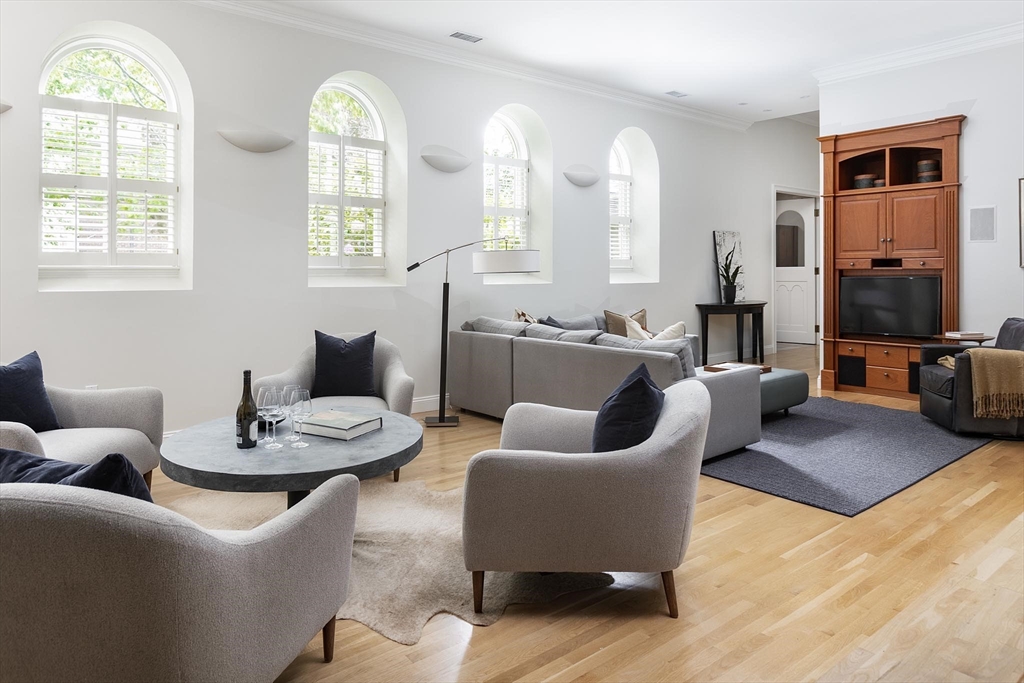 51 Rawson Road, Unit 51 Brookline, MA 02445 - Photo 7 of 23 a living room with furniture and a large window