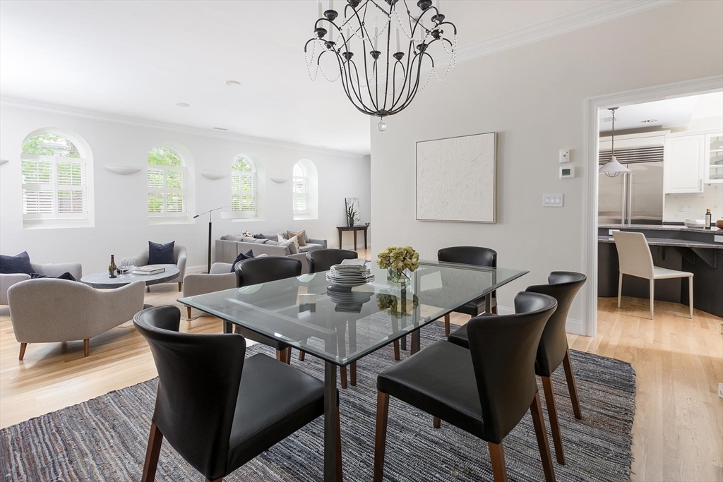 51 Rawson Road, Unit 51 Brookline, MA 02445 - Photo 8 of 23 a view of a dining room with furniture and chandelier