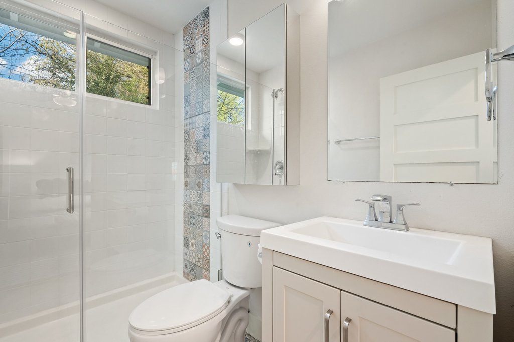 2702 Crest Avenue, Unit 1 Austin, TX 78702 - Photo 21 of 29 The updated primary bathroom features modern finishes that complement the home's timeless design.