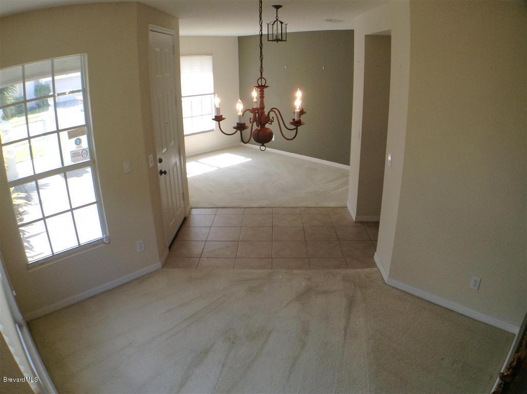 989 Riviera Point Drive Rockledge, FL 32955 - Photo 11 of 25 Formal Dining to Living