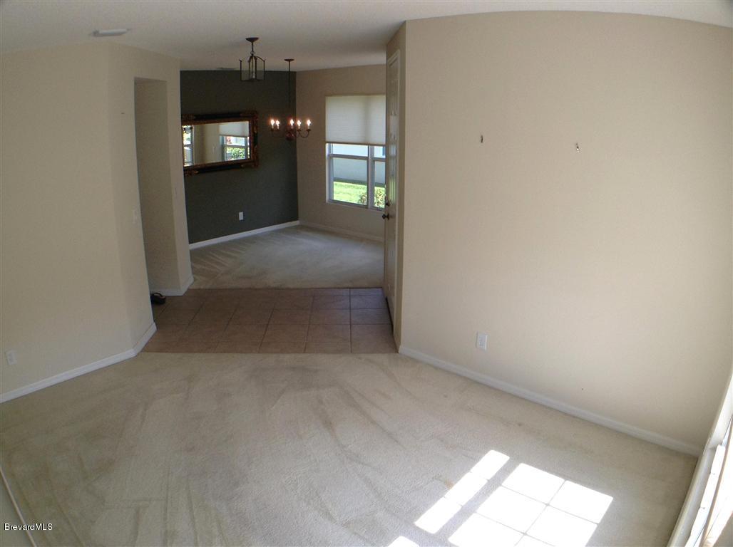989 Riviera Point Drive Rockledge, FL 32955 - Photo 12 of 25 Formal Living to Dining
