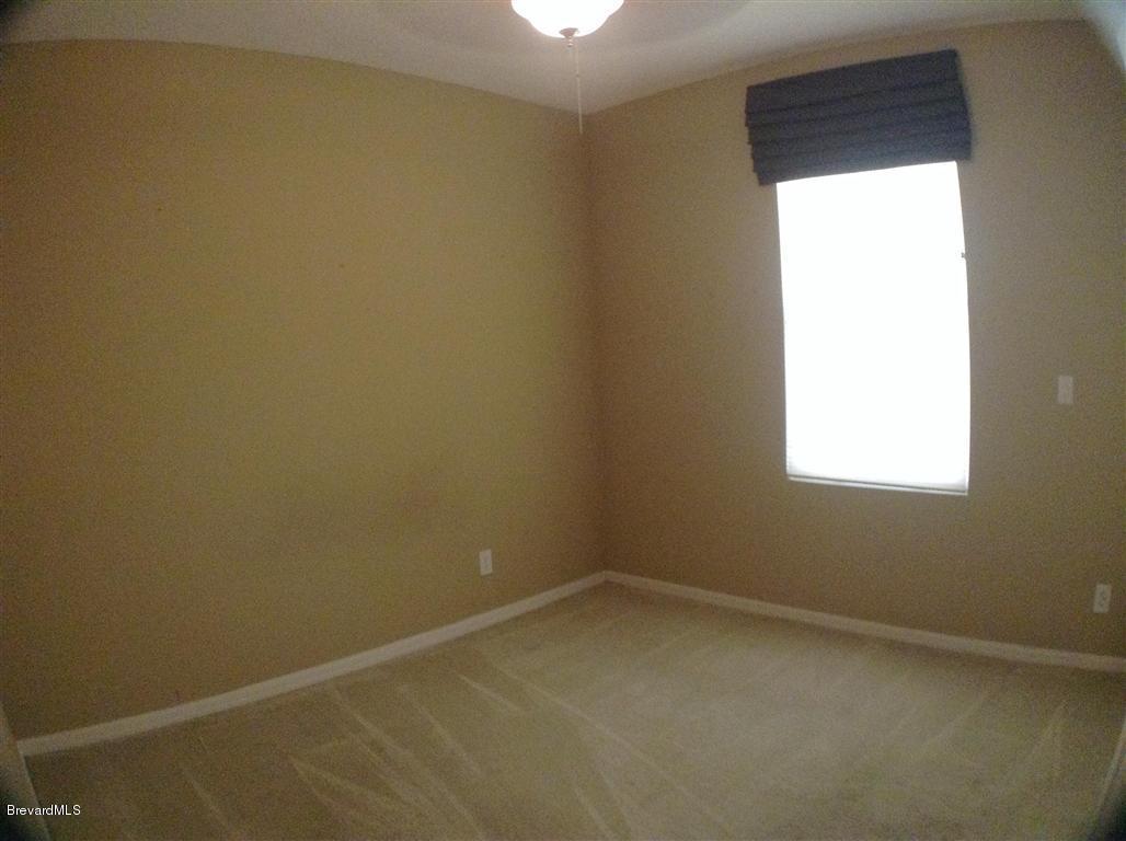 989 Riviera Point Drive Rockledge, FL 32955 - Photo 22 of 25 Spare Bedroom