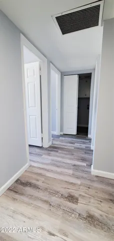 a view of a livingroom with wooden floor