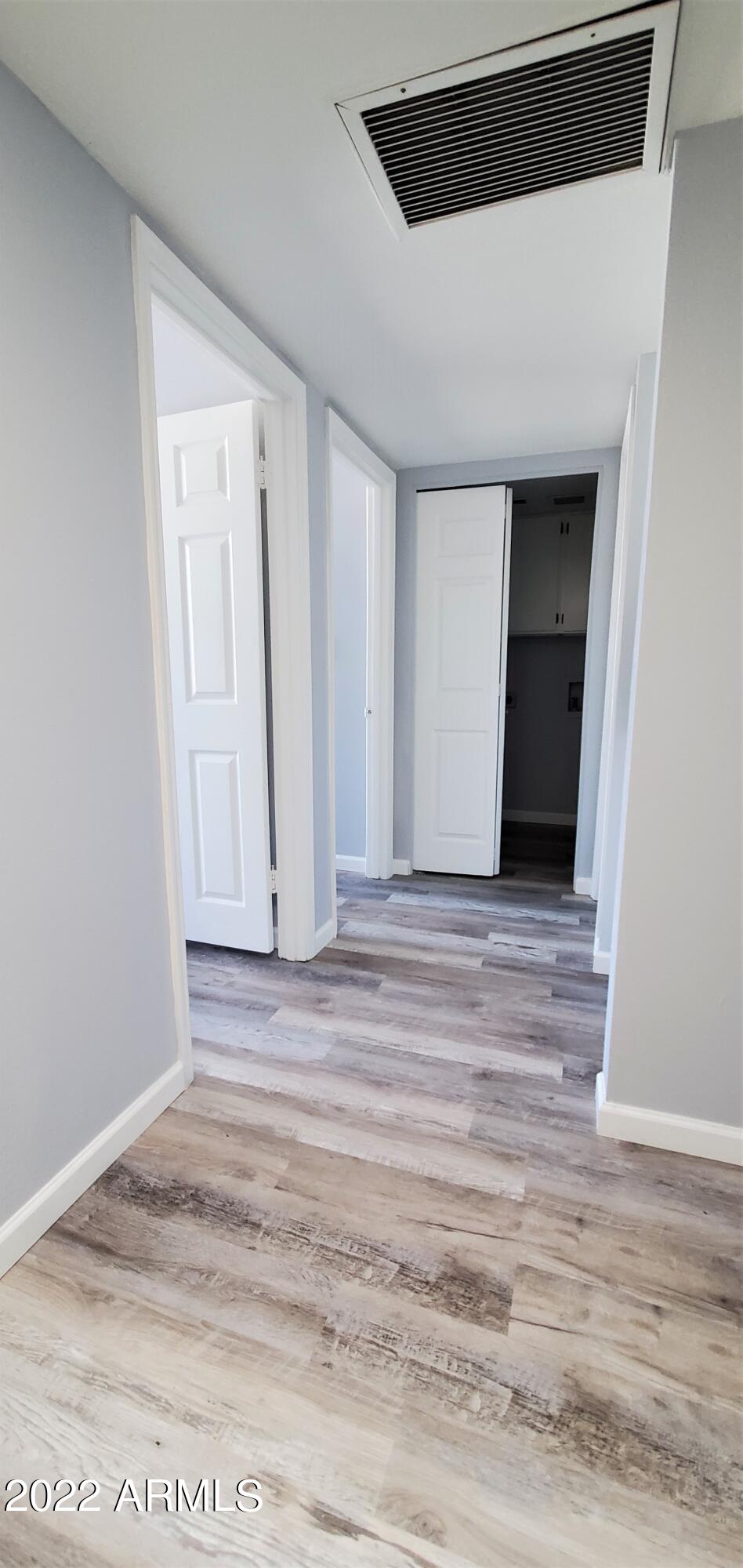 3411 North 12th Place, Unit 8 Phoenix, AZ 85014 - Photo 12 of 41 a view of a livingroom with wooden floor