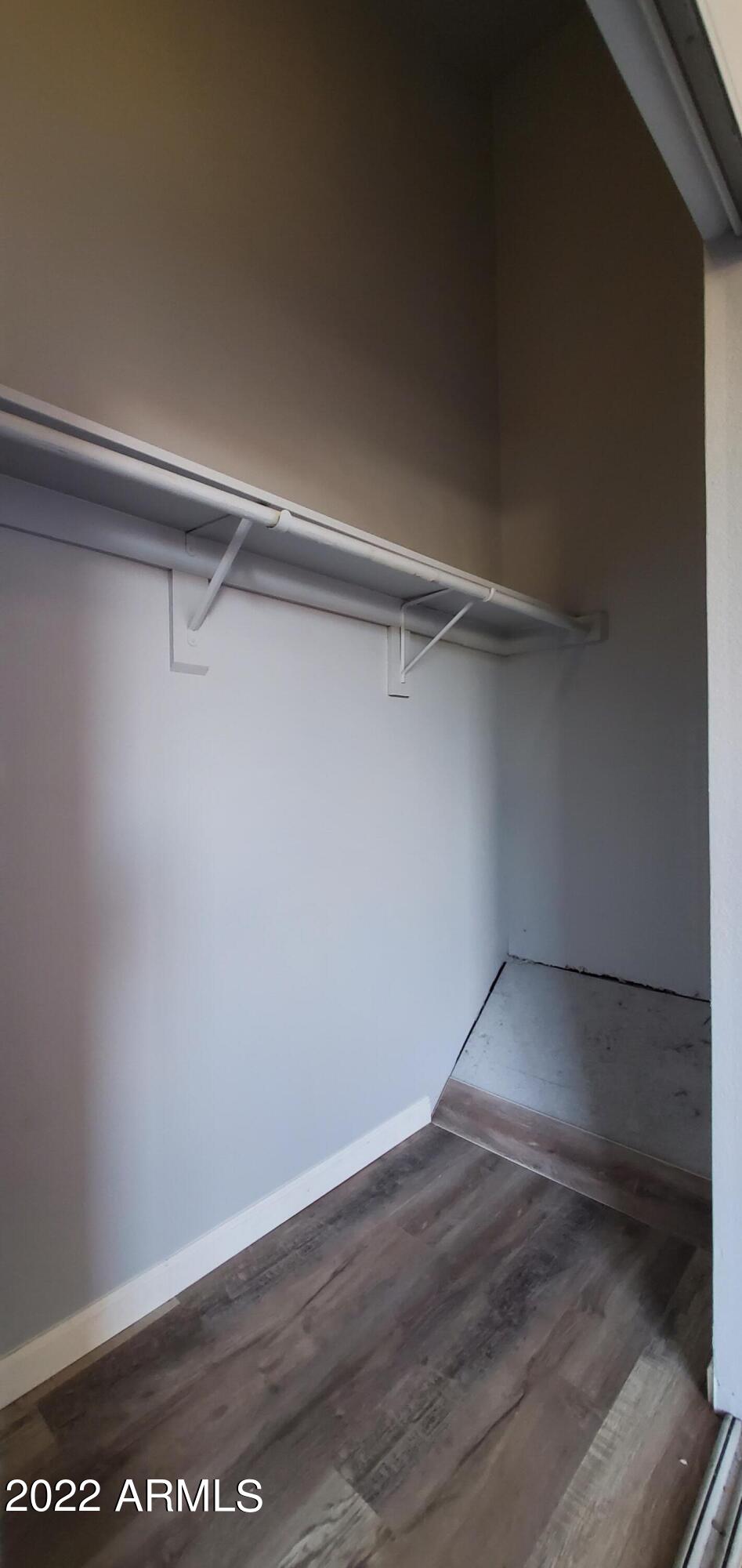 3411 North 12th Place, Unit 8 Phoenix, AZ 85014 - Photo 23 of 41 a view of an empty walk in closet