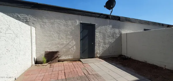 a backyard of a house with wooden fence