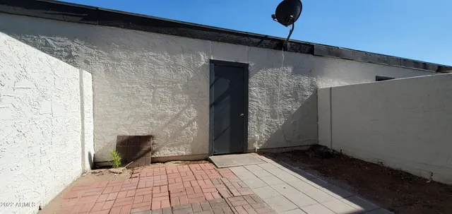 a backyard of a house with wooden fence