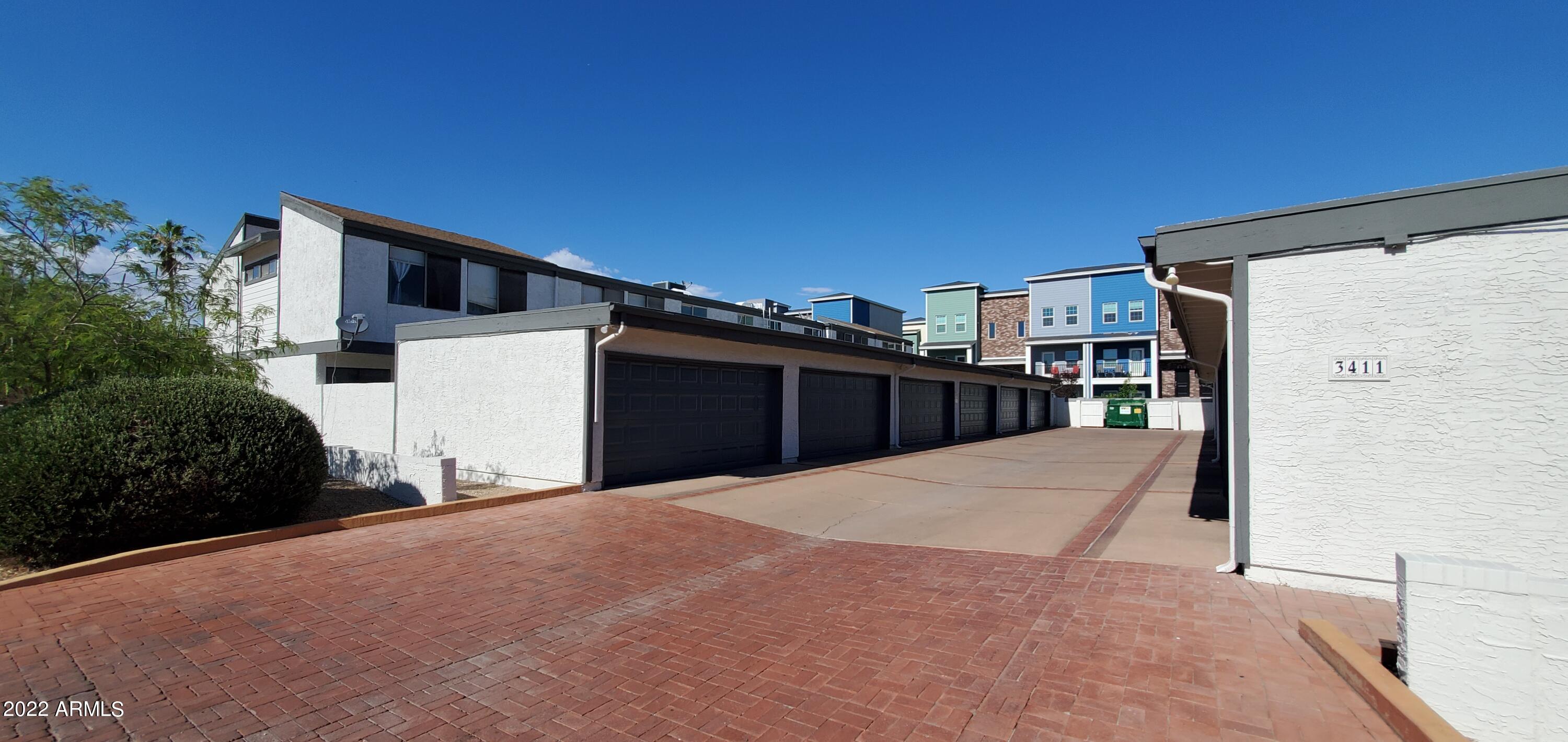 3411 North 12th Place, Unit 8 Phoenix, AZ 85014 - Photo 41 of 41 a backyard of a house with wooden fence