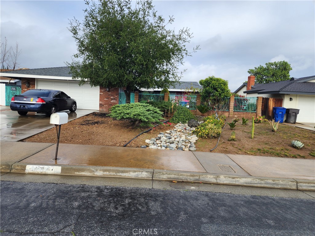 4267 Baggett Drive Riverside, CA 92505 - Photo 2 of 24 a front view of a house with garden