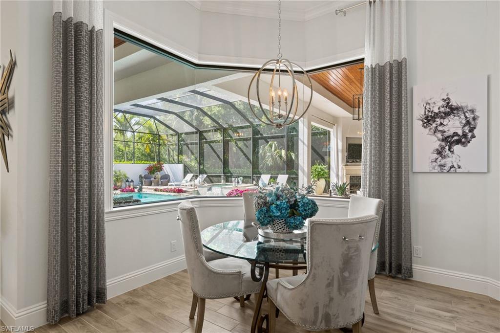 6363 Burnham Road Naples, FL 34119 - Photo 16 of 38 a dining room with furniture and window