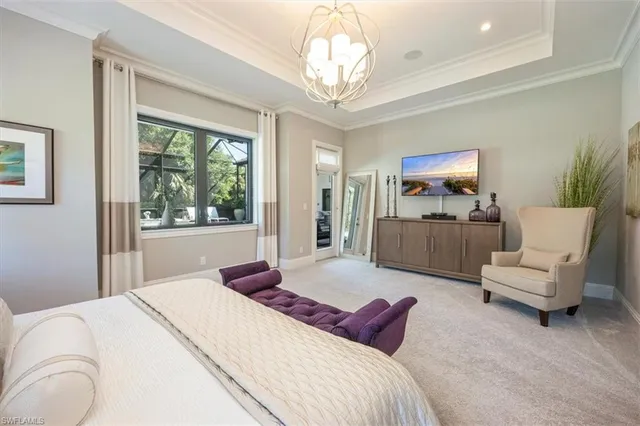 a bedroom with bed and window with couch