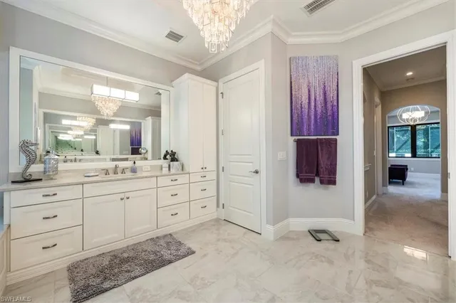 a spacious bathroom with a shower sink and mirror