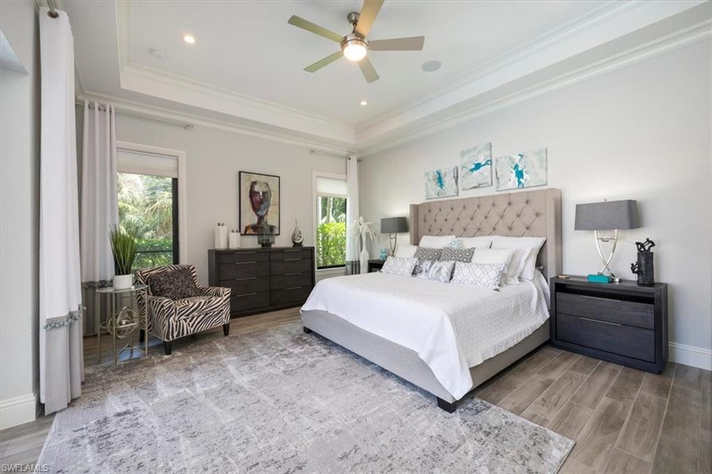 6363 Burnham Road Naples, FL 34119 - Photo 24 of 38 a bedroom with a bed and window