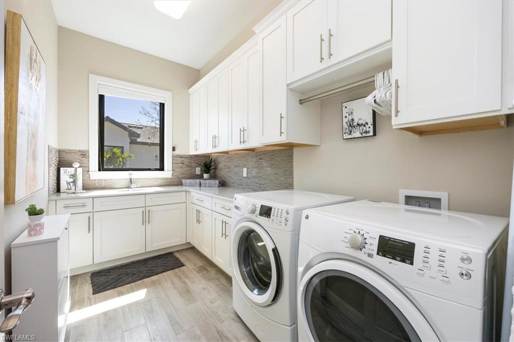 6363 Burnham Road Naples, FL 34119 - Photo 26 of 38 a utility room with sink dryer and washer