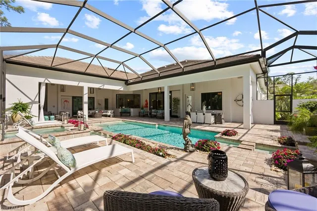 a view of a dining room with furniture wooden floor and potted plants