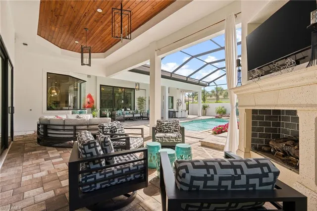 a outdoor living space with patio furniture and a fireplace