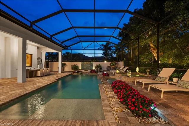 a view of swimming pool with outdoor seating