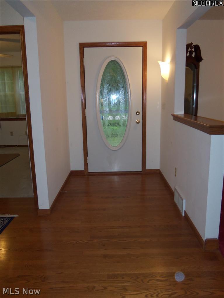 210 Birch Road Painesville, OH 44077 - Photo 4 of 25 NO CROWDING WHEN GREETING GUESTS IN THE LARGE FOYER FEATURING HARDWOOD FLOORS.