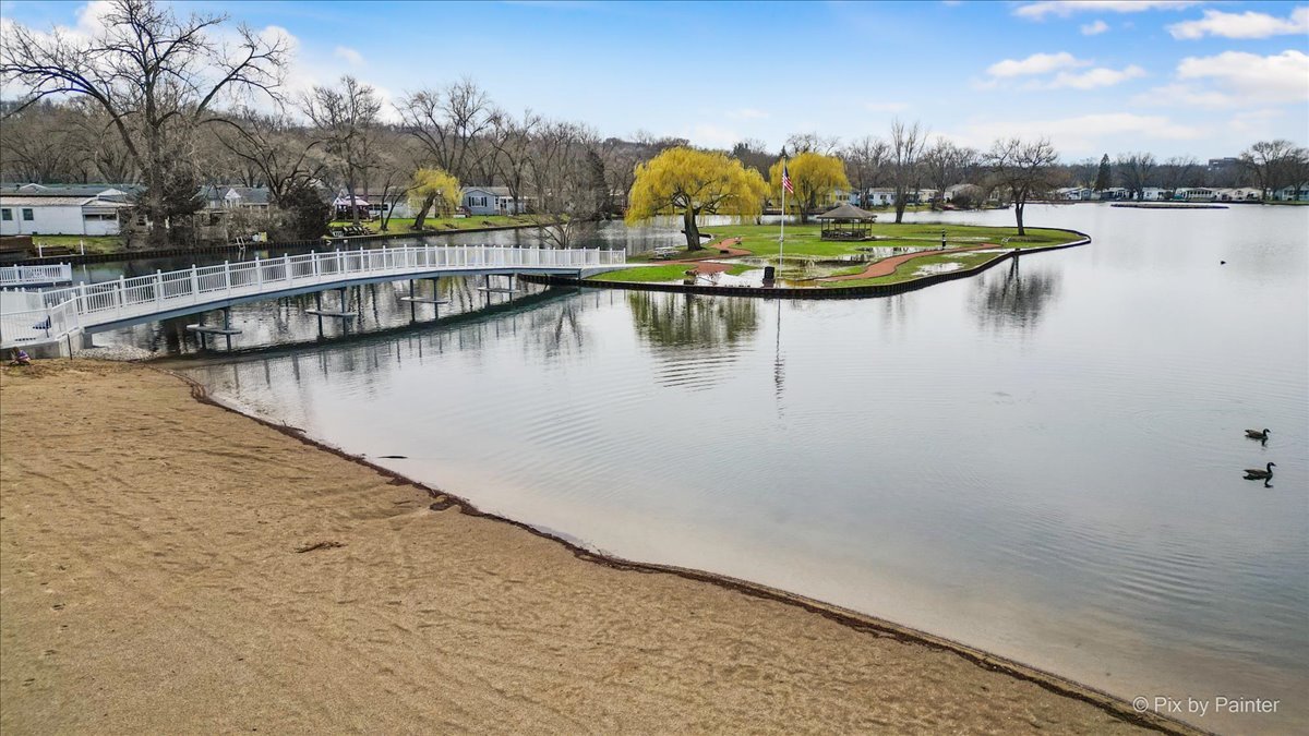 173 Northshore Road Elgin, IL 60123 - Photo 26 of 39 a view of a lake with houses