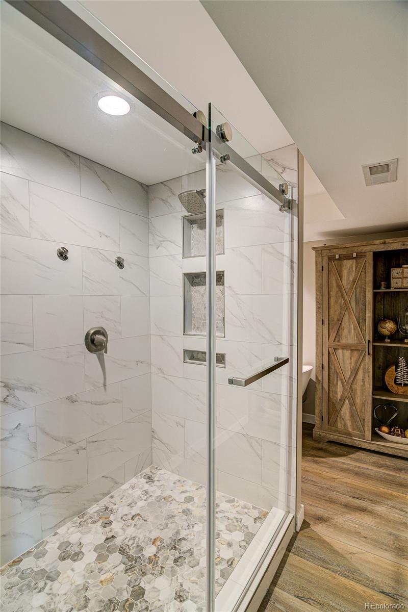 4531 East Best Road Larkspur, CO 80118 - Photo 16 of 49 a bathroom with a shower