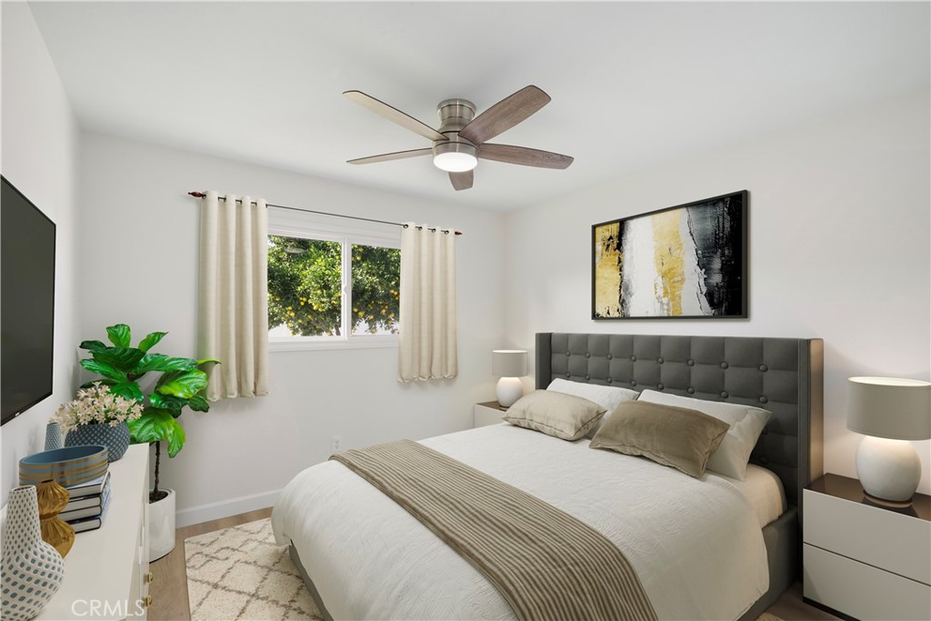 3670 Upper Terrace Drive Riverside, CA 92505 - Photo 13 of 30 a bedroom with a large bed and a potted plant