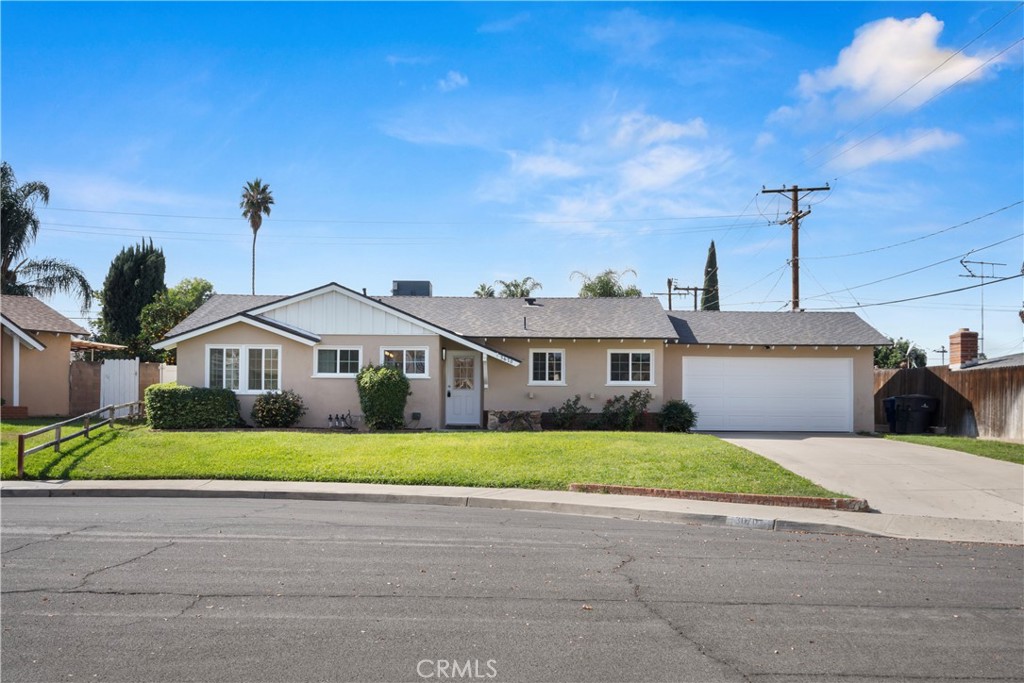 3670 Upper Terrace Drive Riverside, CA 92505 - Photo 2 of 30 a front view of a house with a yard and garage