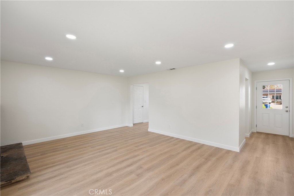 3670 Upper Terrace Drive Riverside, CA 92505 - Photo 5 of 30 an empty room with wooden floor and windows