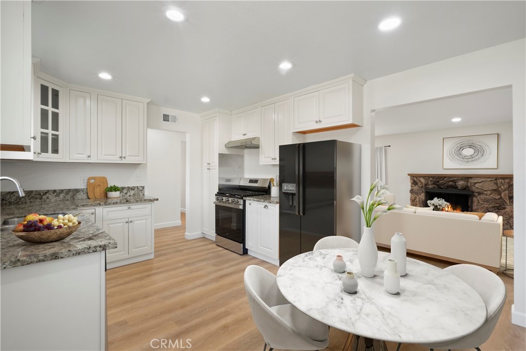 3670 Upper Terrace Drive Riverside, CA 92505 - Photo 6 of 30 a kitchen with a sink stainless steel appliances and white cabinets