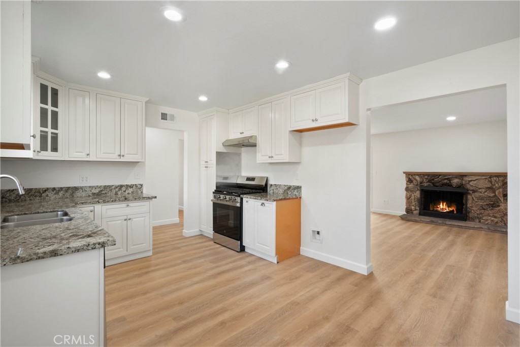 3670 Upper Terrace Drive Riverside, CA 92505 - Photo 8 of 30 a kitchen with a refrigerator and a stove top oven