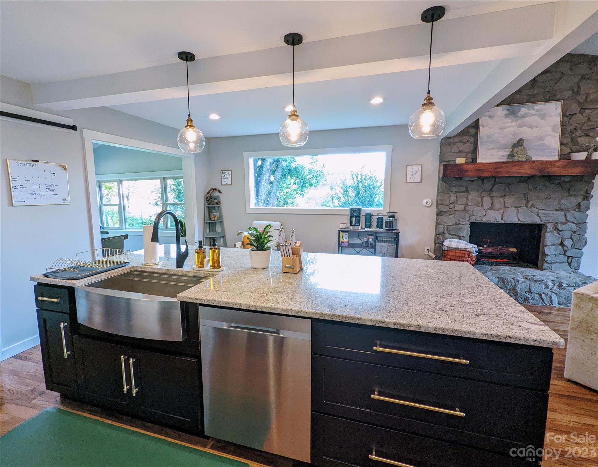 111 Vision Road Canton, NC 28716 - Photo 8 of 22 a kitchen with a stove and a wooden floor