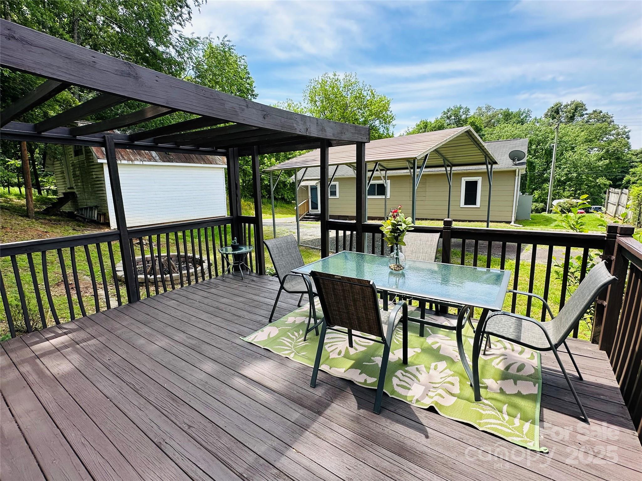 421 Bethel Road Morganton, NC 28655 - Photo 14 of 40 a view of house with a deck and furniture