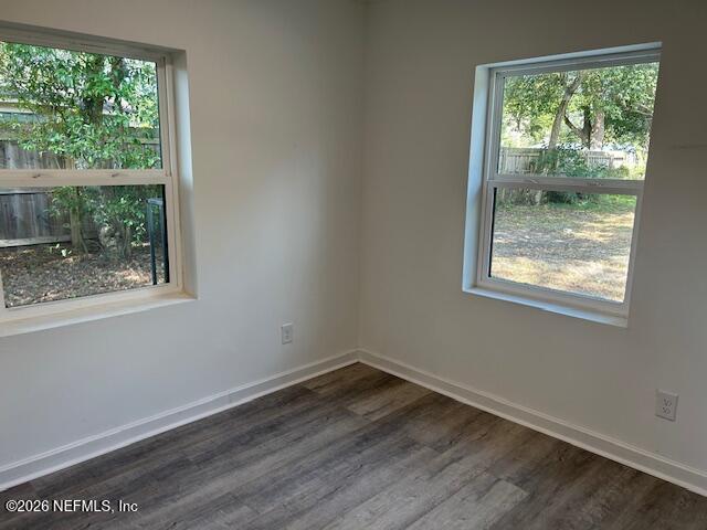 9727 Tiffany Avenue Jacksonville, FL 32246 - Photo 15 of 19 a view of an empty room with wooden floor and a window