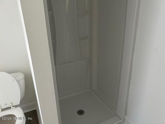 9727 Tiffany Avenue Jacksonville, FL 32246 - Photo 19 of 19 a bathroom with a glass door shower