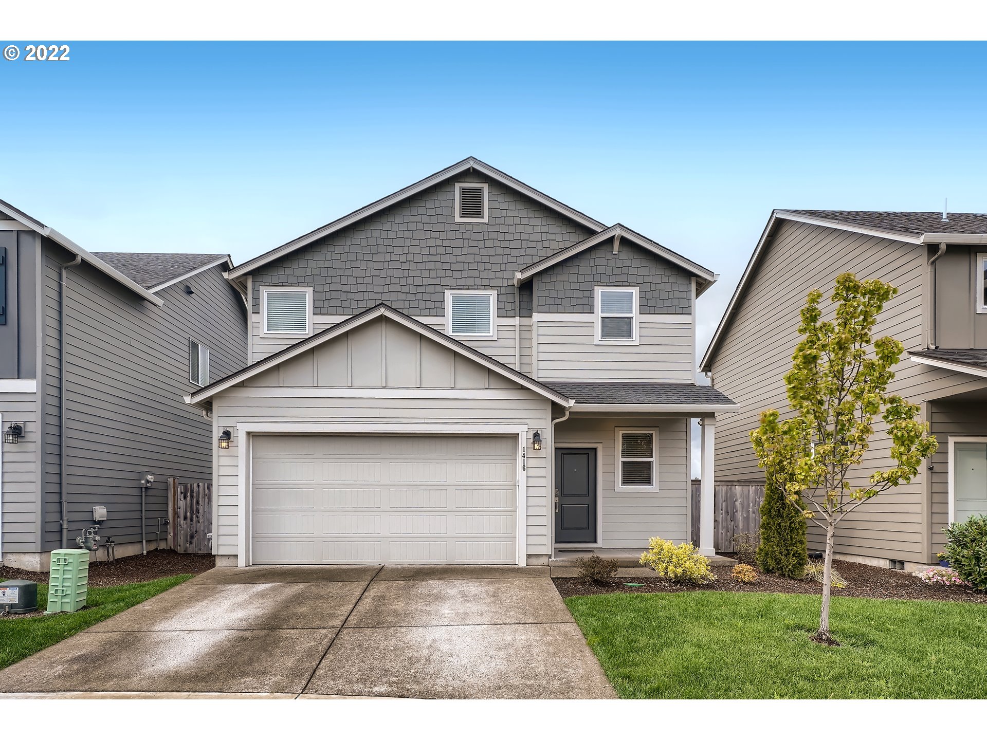 1416 Northeast 172nd Street Ridgefield, WA 98642 - Photo 1 of 28 a front view of a house with a yard and garage