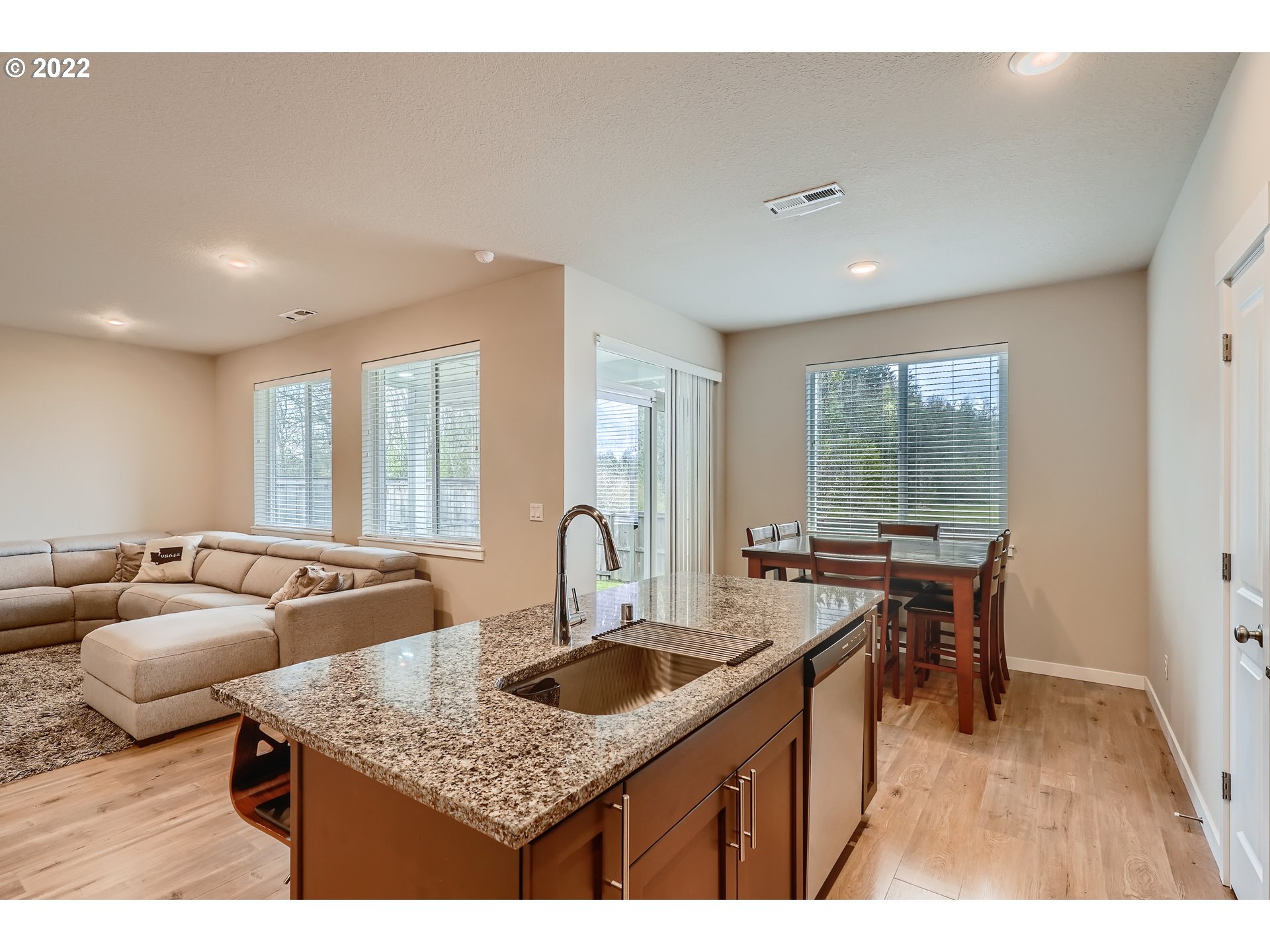 1416 Northeast 172nd Street Ridgefield, WA 98642 - Photo 13 of 28 a kitchen with counter space sink and living room