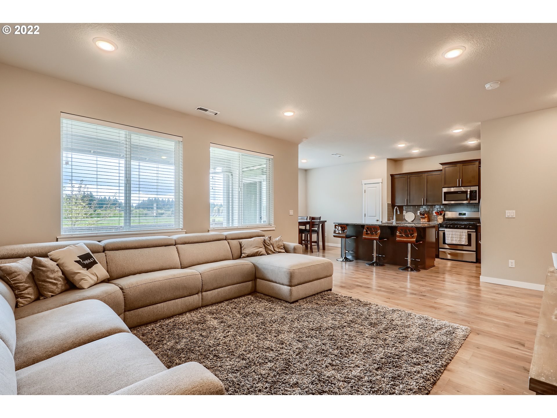 1416 Northeast 172nd Street Ridgefield, WA 98642 - Photo 8 of 28 a living room with furniture and wooden floor
