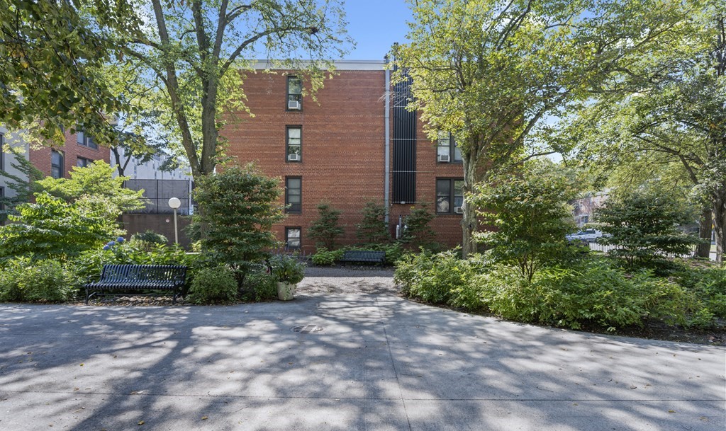 8 Juniper Street, Unit 22 Brookline, MA 02445 - Photo 11 of 11 a view of a pathway both side of house