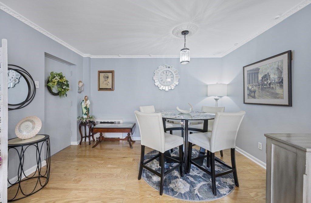 8 Juniper Street, Unit 22 Brookline, MA 02445 - Photo 3 of 11 a view of a dining room with furniture