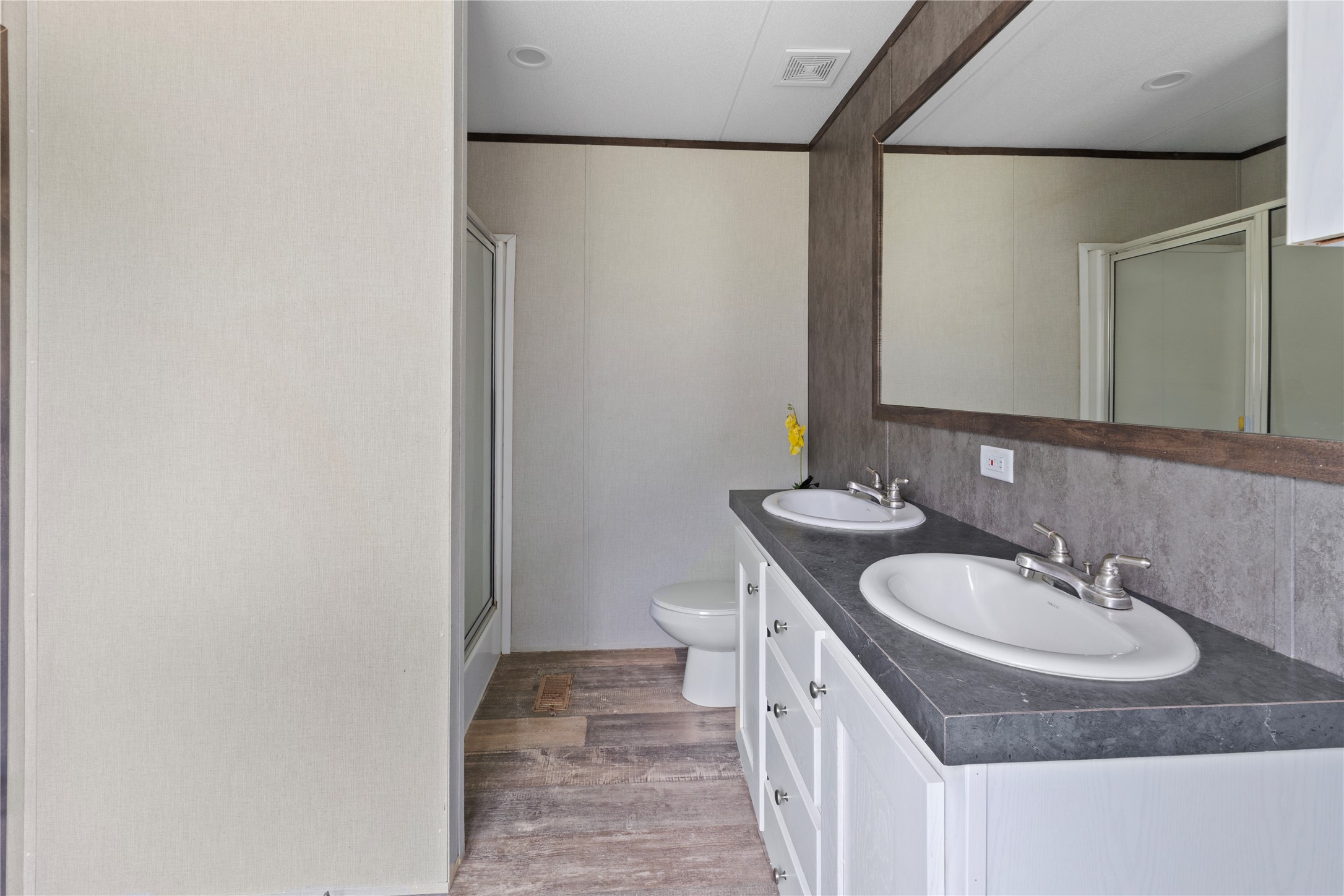 109 Hibiscus Cove Elgin, TX 78621 - Photo 10 of 15 Double vanity and spacious shower create a functional, well-appointed primary bathroom.